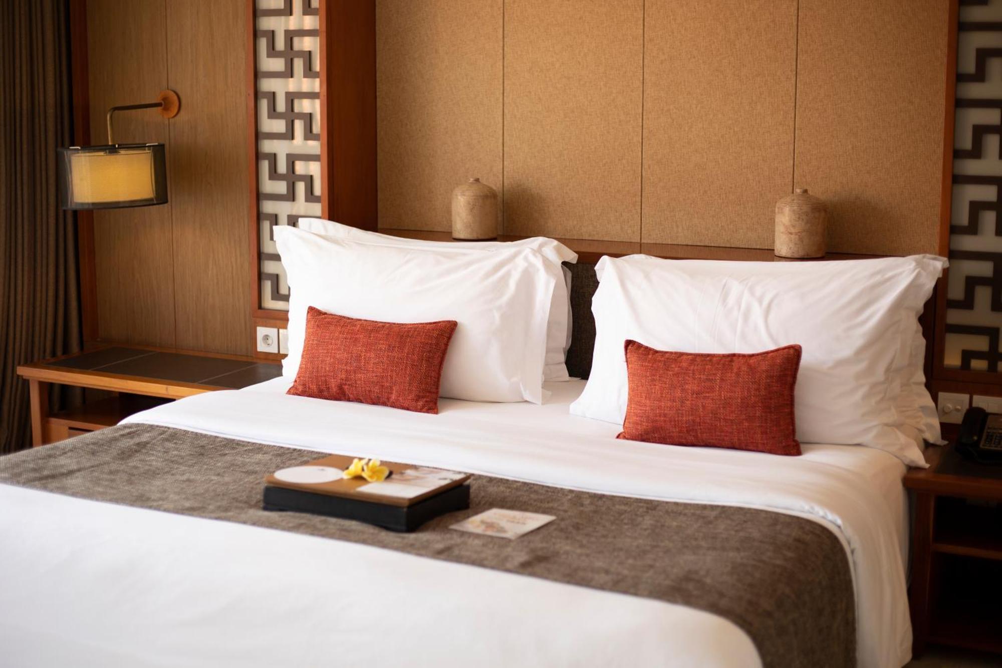 The Bandha Hotel & Suites Legian Exterior foto A bed